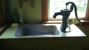 Sink with in-house pump